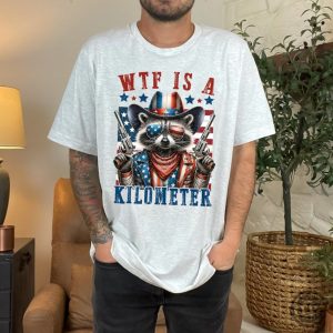 Retro Wtf Is A Kilometer Raccoon Funny Usa Flag Funny Gamer Shirt honizy 3