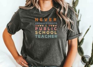 Never Underestimate A Public School Teacher Shirt Harris Walz 2024 Rally Merch Tim Walz Dnc Quote Tshirt Educator Sweatshirt Teacher Gift honizy 2